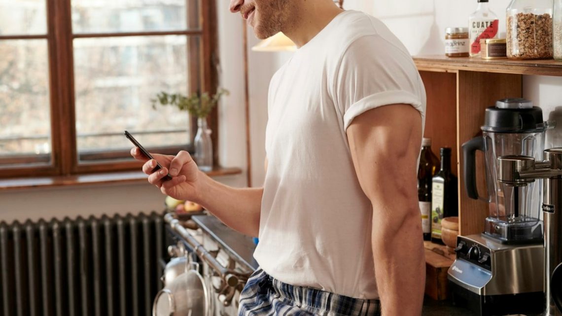 Man smiling at phone