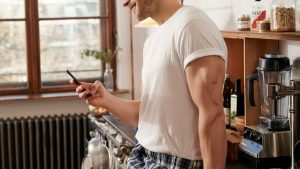 Man smiling at phone